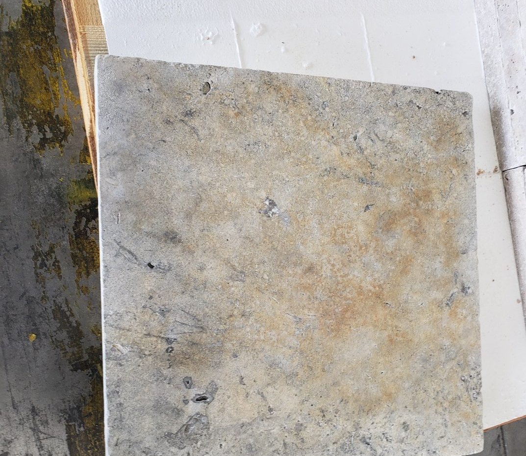 Stained marble paver before bleach test