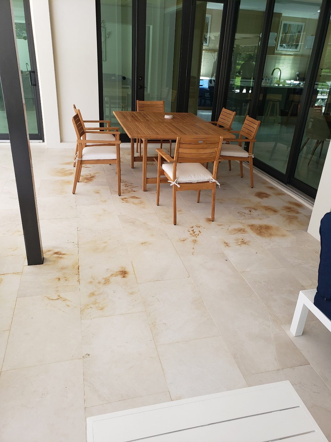 Covered patio with iron staining concentrated under cover