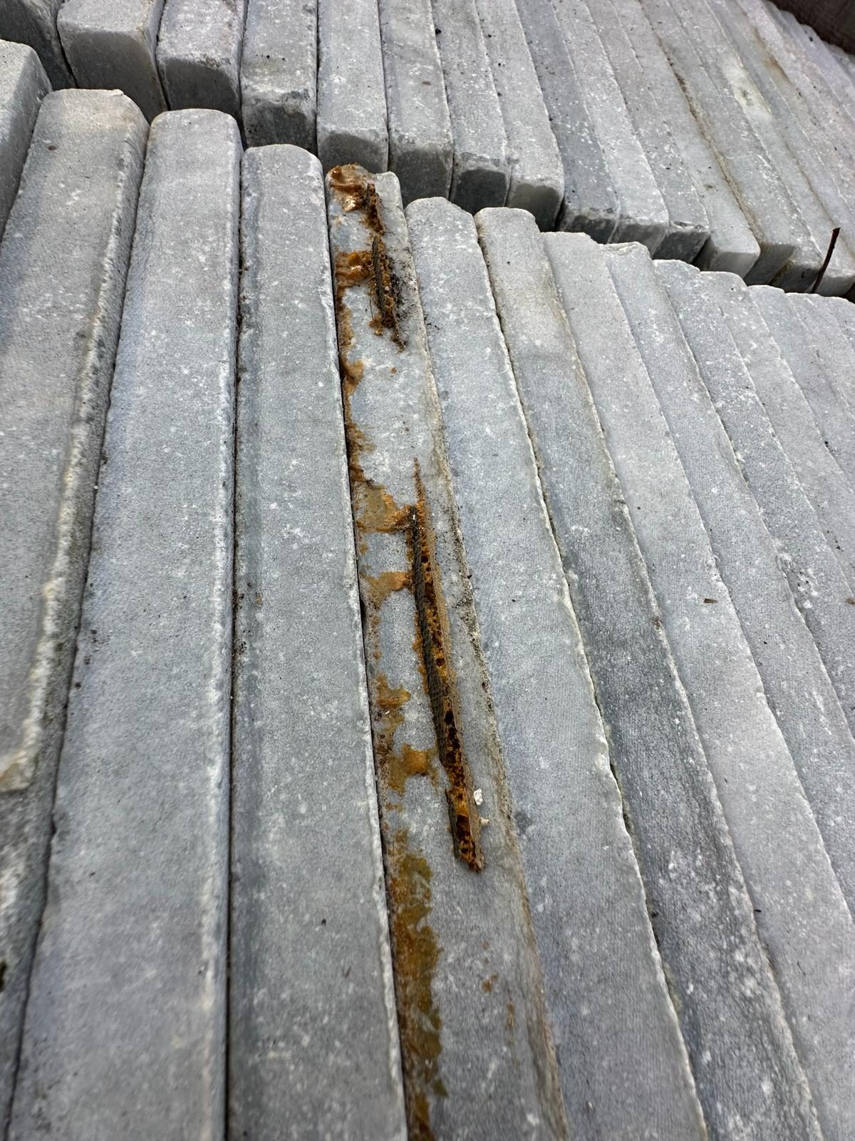 Visible rust staining in bedding sand at supplier yard